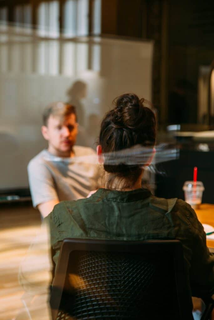 Male and female talking in a comfortable manner